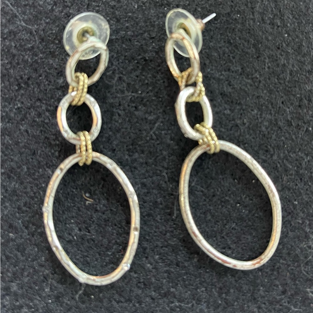Silver and gold dangle earrings.